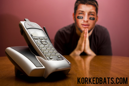 Man praying for the phone to ring