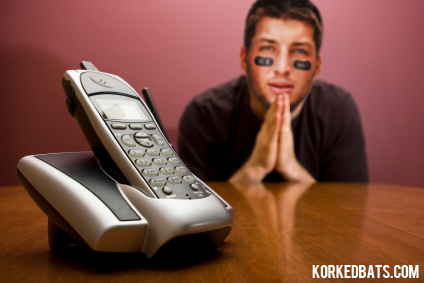 Man praying for the phone to ring